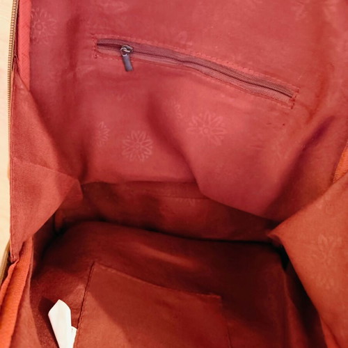 Brown backpack like new with leather texture and two compartments