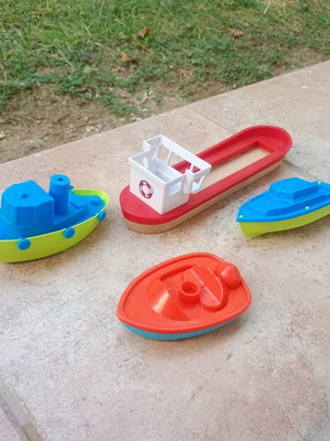 Set of 4 toy boats, 3 plastic and 1 wooden