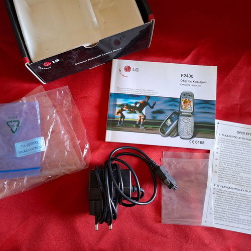 LG F2400 mobile phone packaging like new with charger and manual