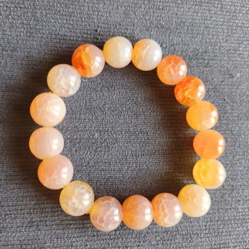 Bracelet with orange beads elastic, like new