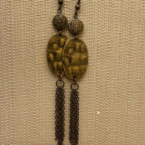 Dangling earrings lightly worn