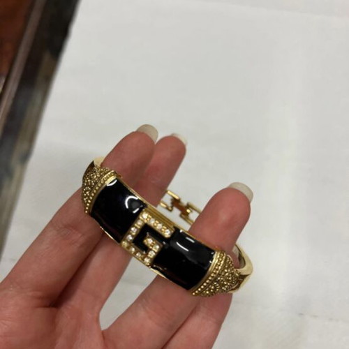 Bracelet like new with black and gold design