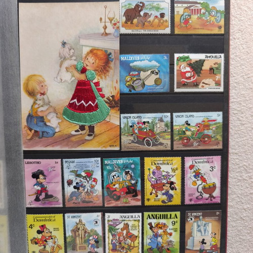 Disney collectible album with 220 stamps and 16 cards