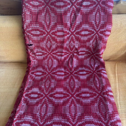 Wool woven blanket used, red with traditional pattern
