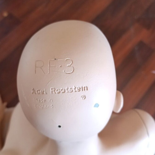 Rootstein English doll used, seated on hip