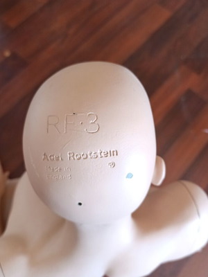Rootstein English doll used, seated on hip