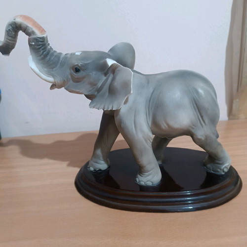 Vintage decorative elephant used with wooden base