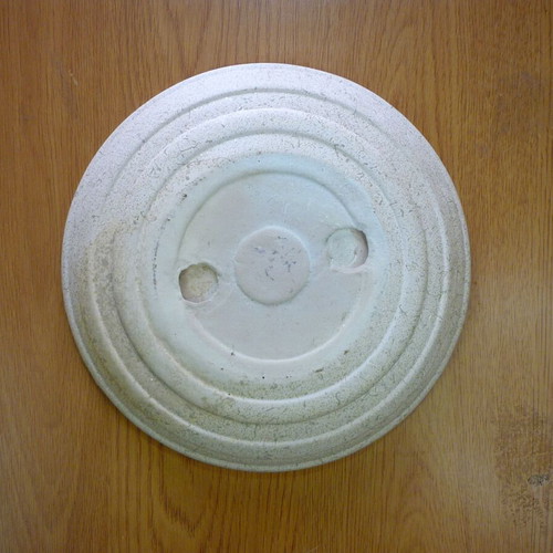Decorative ceramic plate with embossed stars and moons like new