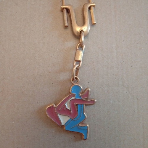 Metal keychain with erotic scene, like new, blue