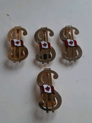 Dollar tie clips with Canadian flag, like new, set of 4