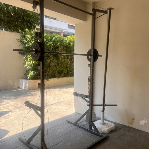 Training rack with barbell and pulley system