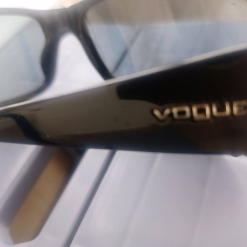 Vogue sunglasses used, black with scratch on lens