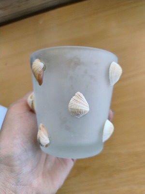 Glass tealight candle holder with seashells
