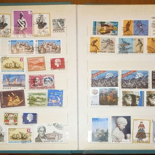 Book with collection of various Greek and foreign stamps used