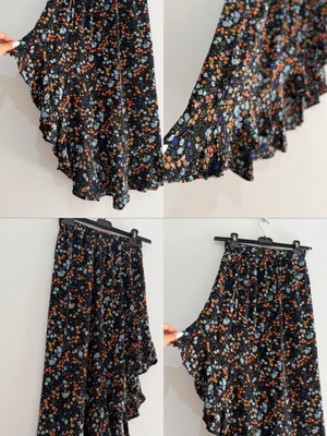 Maxi skirt used with floral pattern, ruffles and asymmetric hem