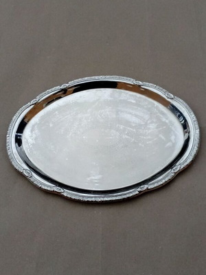 Silver-plated oval serving tray used with floral design