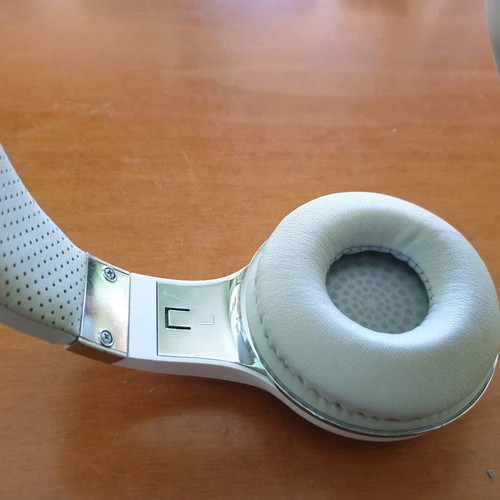 Bluetooth headphones used, white with MP3 and memory card options