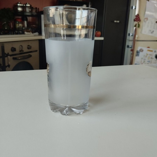 Vintage water glass like new with gold and black decoration