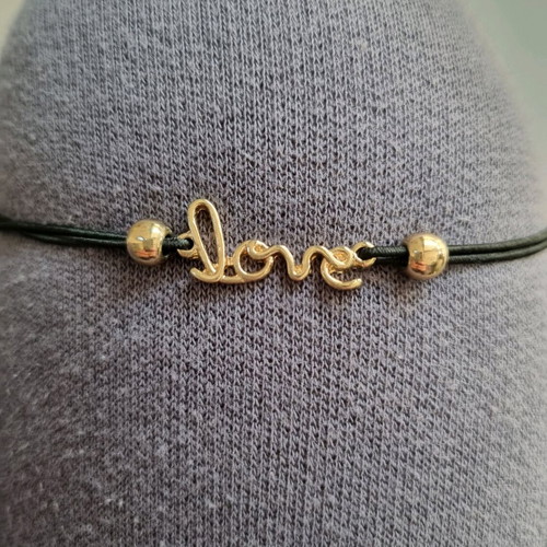 Love bracelet new with adjustable black and gold elastic
