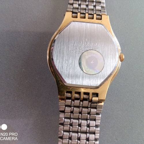 Citizen Qourtz wristwatch used, slim with gold bracelet and white dial