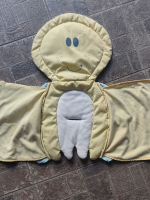 Baby swaddle wrap used, yellow with smiley face design