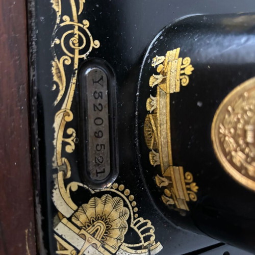 Singer sewing machine in carved furniture used, antique