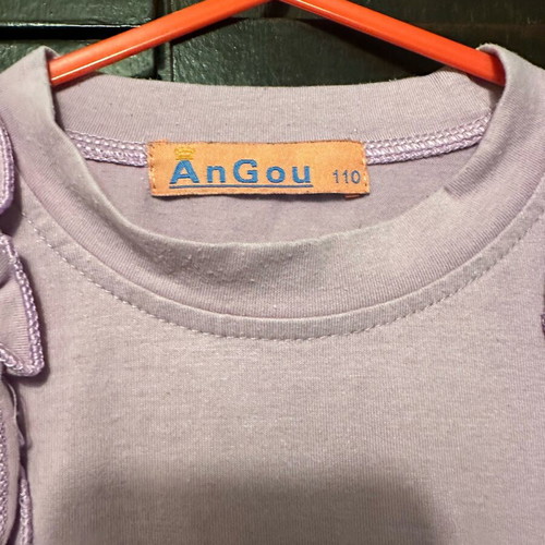 AnGou long-sleeve lilac blouse with 3D orange bow, like new, size 110 cm