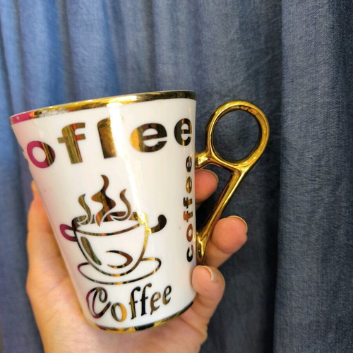 porcelain mug with gold inscriptions