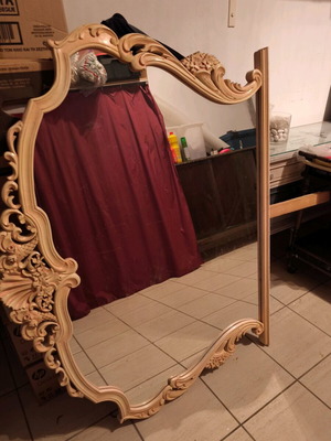 Patina mirror used with intricate carvings