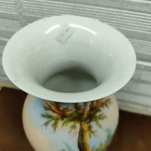 Old porcelain vase used, hand-painted with romantic scene
