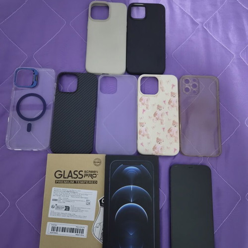 iPhone 12 Pro Max Pacific Blue 128GB like new with 7 cases and screen protectors