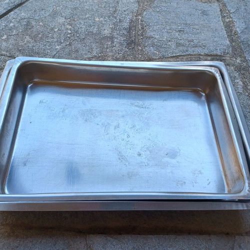 Set of two used stainless steel oven trays