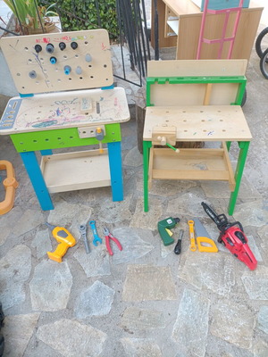 Children's wooden workbench used with tools