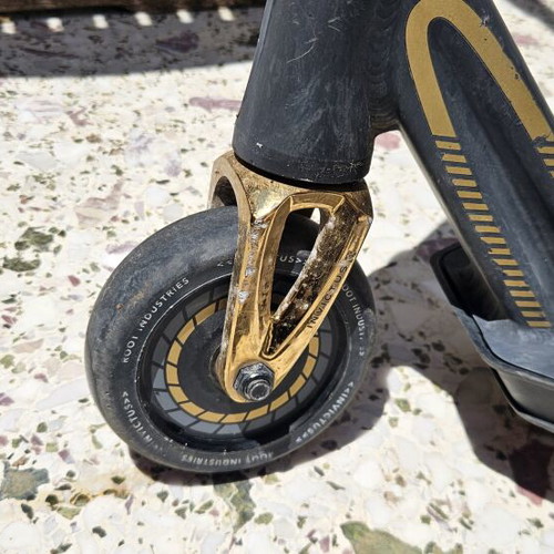 Root Industries Invictus Gold Rush freestyle scooter used with helmet and pads