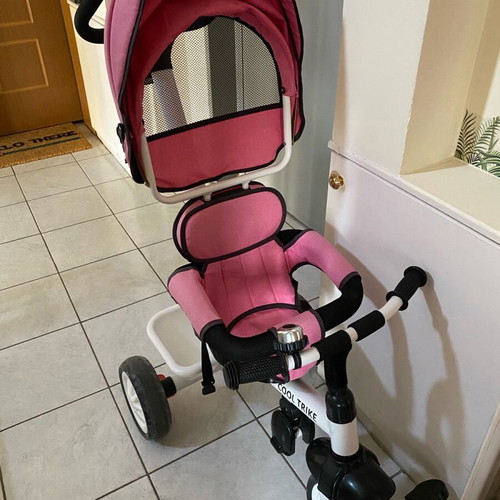 Tricycle pink with parent-controlled steering used