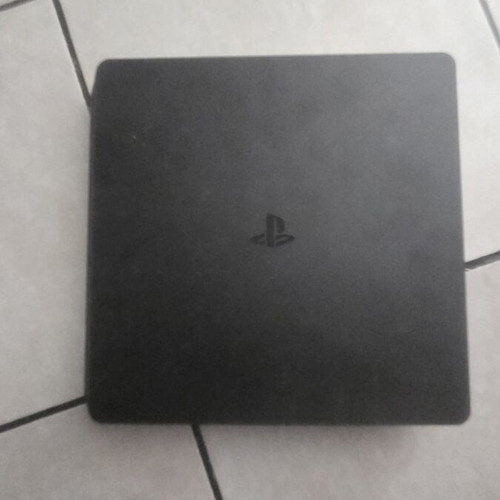 PlayStation 4 Slim 1TB console like new, chipped
