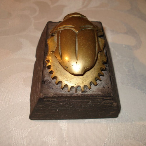 Egyptian bronze decorative scarab used with black hieroglyph base