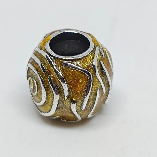 Silver charm bead with gold glitter enamel spiral design like new