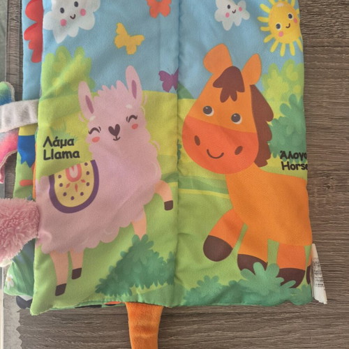 Fabric activity book with scratch sounds like new