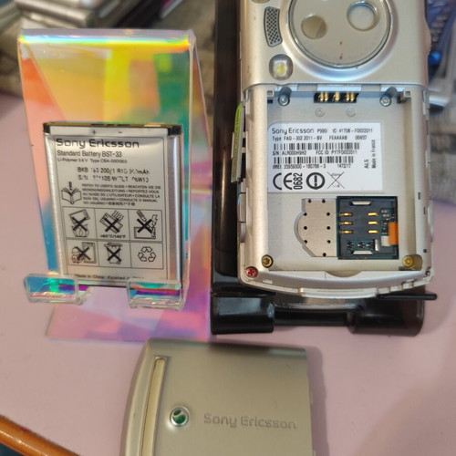 Sony Ericsson P990i vintage cell phone used with charger