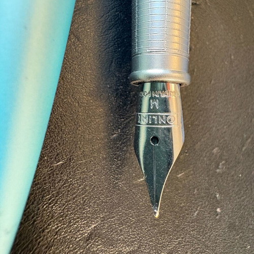 Online pen set like new with black ink and pen