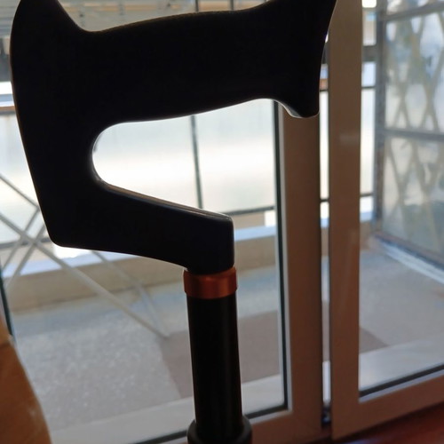 Walking cane with four-legged base used, adjustable height