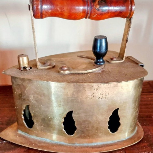Vintage brass coal iron in golden tone, like new