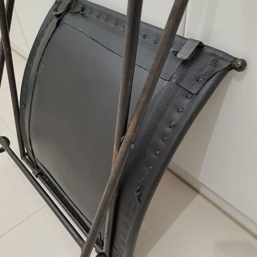 Leather footstool like new, black with cast iron frame