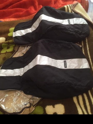 Maclaren Twin Techno twin stroller used with foot protectors and waterproof hood