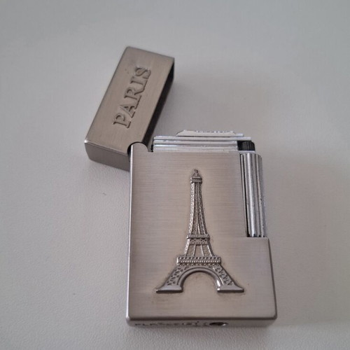 Gas lighter with Eiffel Tower design, like new