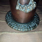 Copper cup used with embossed bronze base and handles