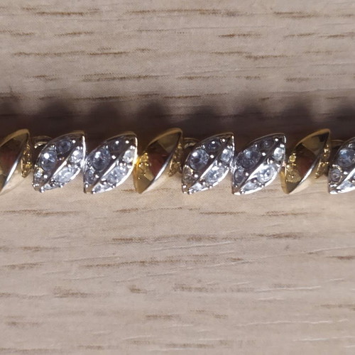 Swarovski bracelet like new, gold tone with crystals