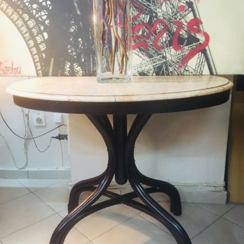 Vintage table with bent wood and oval salmon-pink marble used