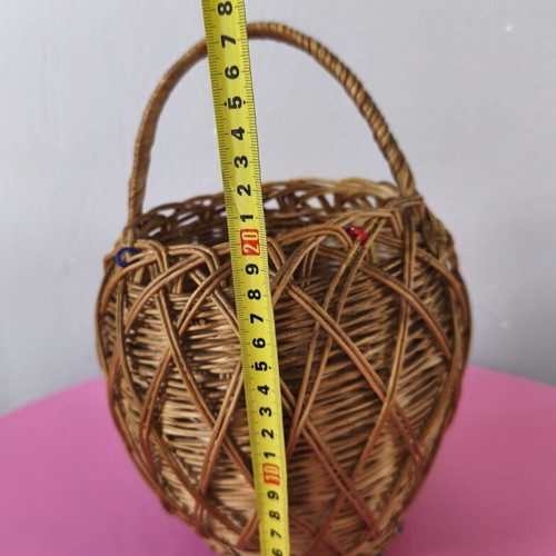 Handmade woven basket used with handle and decorative beads